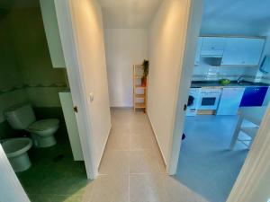 Kuchyň nebo kuchyňský kout v ubytování Apartamento La Caridad + 25 fotografií