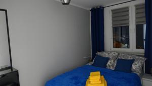 Llit o llits en una habitació de Apartament Jakubek