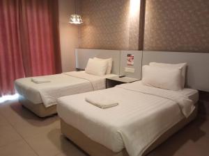 Postel nebo postele na pokoji v ubytování Hotel Jelai @ Temerloh, Pahang