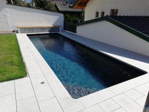 The swimming pool at or close to Haus Grünbacher