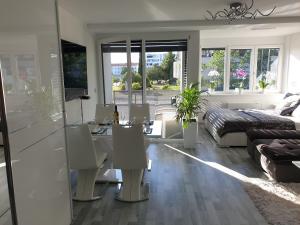 a living room with a bed and a desk at Apartment VAL in Koper