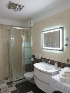 a bathroom with a toilet and a sink and a shower at Apartment VAL in Koper +41 photos