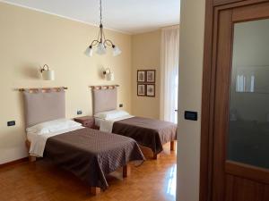 Postel nebo postele na pokoji v ubytování La Via del Sole