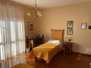Postel nebo postele na pokoji v ubytování La Via del Sole
