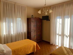 Postel nebo postele na pokoji v ubytování La Via del Sole