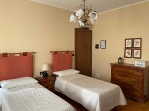 Postel nebo postele na pokoji v ubytování La Via del Sole