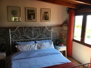 Ένα ή περισσότερα κρεβάτια σε δωμάτιο στο Casa Motta Camastra, panoramahouses, prive zwembad en free wifi