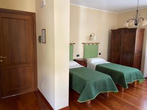 Postel nebo postele na pokoji v ubytování La Via del Sole