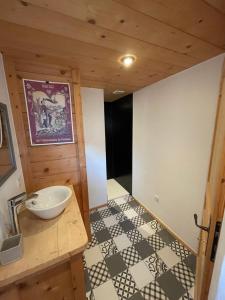 a bathroom with a sink and a counter top at Chalet cosy proche Tramway du Mont-Blanc et centre in Saint-Gervais-les-Bains +19 photos