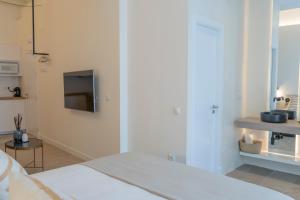Łóżko lub łóżka w pokoju w obiekcie Suites Alfonso X