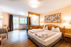 Postel nebo postele na pokoji v ubytování Albergo Conturina