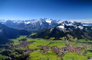 an aerial view of a village in the mountains at Alpenstyle Ferienwohnung mit Südbalkon in Geisteier's Hüs in Bad Oberdorf +14 photos