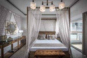 Postel nebo postele na pokoji v ubytování Hotel Matheo Villas & Suites
