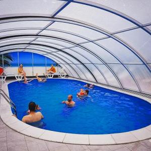 a group of people in a swimming pool at Villa Kalypso in Bihać