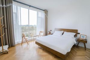 Letto o letti in una camera di 峨眉山一方民宿Mount Emei Little Place Guesthous