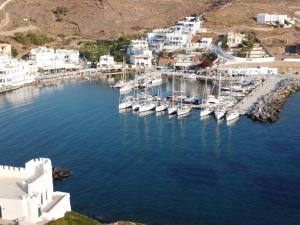 an aerial view of a harbor with boats in the water at Aiolos Studios Κythnos in Kithnos