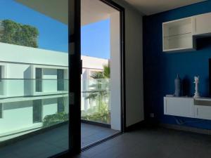 a room with a large glass door with a view at Luxury Anfaplace Living Resort in Casablanca +3 photos