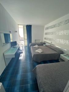 Ein Bett oder Betten in einem Zimmer der Unterkunft Hotel San Paolo