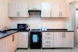 A kitchen or kitchenette at Sweet Retreat-1