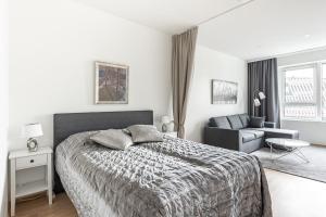 Postel nebo postele na pokoji v ubytování ARENA Junior Suite