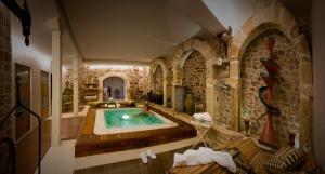 a large room with a swimming pool in a building at El Morendal in Almarza
