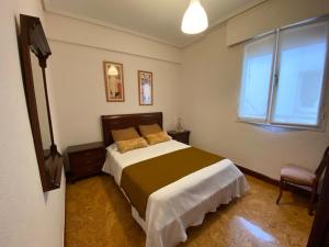 Postel nebo postele na pokoji v ubytování Apartamento Alonso 1