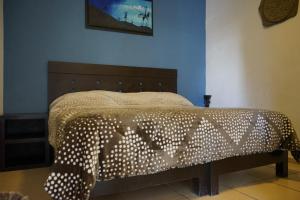 
Cama o camas de una habitación en Telpochcalli Hotel & Temazcal
