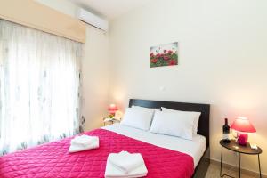 Postel nebo postele na pokoji v ubytování Aloe Apartments