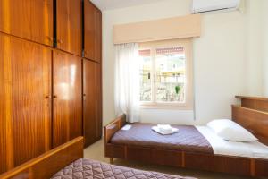 Postel nebo postele na pokoji v ubytování Aloe Apartments