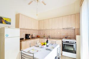 Kuchyň nebo kuchyňský kout v ubytování Aloe Apartments