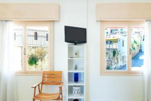 TV a/nebo společenská místnost v ubytování Aloe Apartments