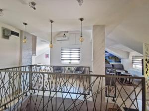 a staircase leading to the living room and dining room at Apartman Ananas Banja Luka centar bolnica besplatan parking in Banja Luka
