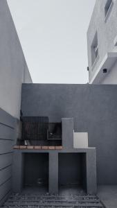 a concrete bench sitting in the corner of a building at Juana House in San Juan