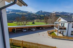 a view from the balcony of a house with mountains in the background at Happy Aich 3 by Alpenidyll Apartments in Aich