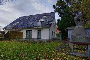 a house with a roof with solar panels on it at Hirschberger, Christian, FW 1 in Zingst