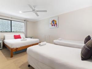 Voodi või voodid majutusasutuse Belle Vue Beach House by Discover Stradbroke toas