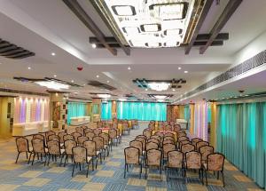 a large room with a bunch of chairs in it at Ghar 365 Residency in Guwahati