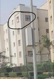 a building with a basketball hoop in front of it at شقة ثلاث غرف ,للعائلات فقط ,Sunrise Sunset1 in King Abdullah Economic City
