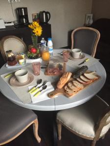 a white table with food on top of it at La suite d'Arras in Agny +23 photos