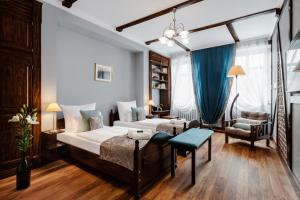 Łóżko lub łóżka w pokoju w obiekcie Baron Boutique Hotel