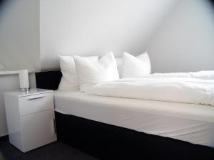 Llit o llits en una habitació de La Domus Premium