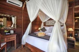 Postel nebo postele na pokoji v ubytování PAWANA VILLAS