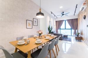 a dining room with a wooden table and chairs at Contemporary Muji 现代简约日系民宿 Mytown & IKEA 8pax in Kuala Lumpur