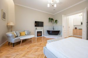 TV a/nebo společenská místnost v ubytování Central Park Apartments