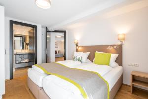 Letto o letti in una camera di Edelweiss Apartments 200m zum Lift - Silvretta Card Premium Inklusive