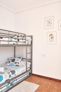 Ένα ή περισσότερα κρεβάτια σε δωμάτιο στο Apartamento El Coso