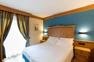 Posteľ alebo postele v izbe v ubytovaní Hotel Medil