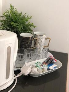 a plate with toothbrushes and a toaster on a table at Mayfair Guest House in Cardiff