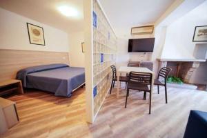 Voodi või voodid majutusasutuse Hotel Capo Di Stella toas