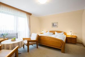 Postel nebo postele na pokoji v ubytování Gästehaus Prinzregent Luitpold